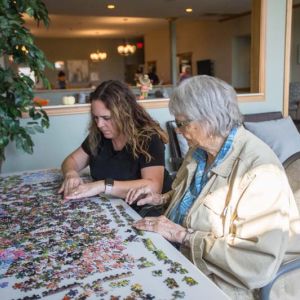 Sunset Ridge Memory Care - Caregiver with Resident